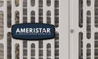 This is a closeup of an Ameristar home air conditioner unit with the blue company logo.